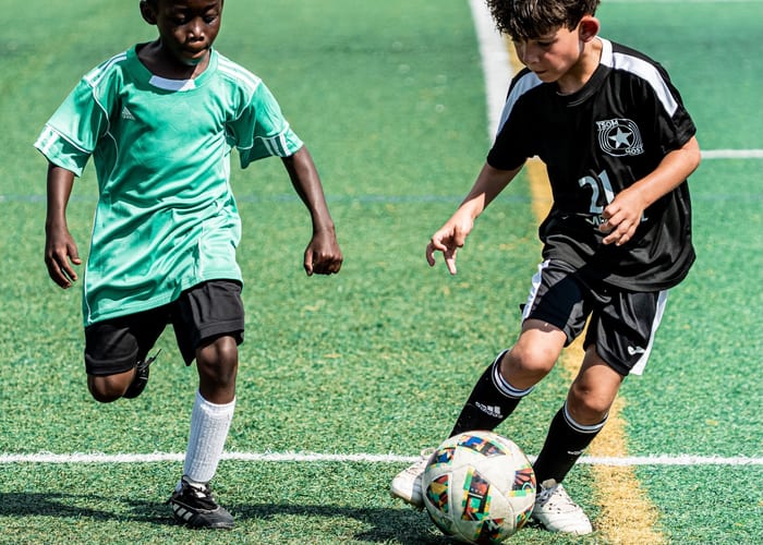 Youth soccer players competing on the field