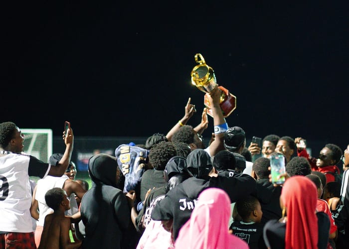 Youth soccer award ceremony with proud winners holding trophies