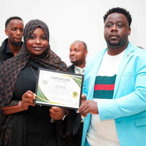 Young woman receiving an award on stage at the recognition ceremony