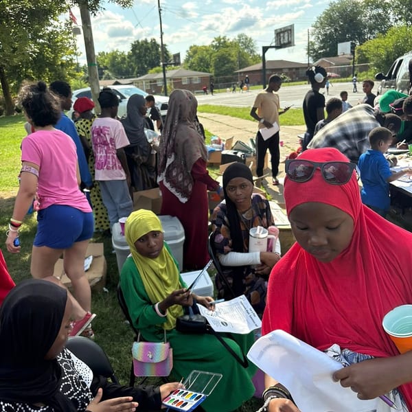 Diverse families gathering at the community support event