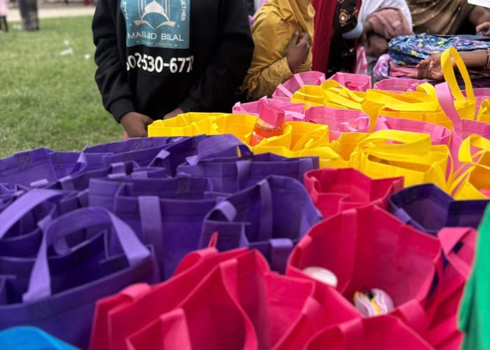 Volunteers distributing school supplies to families at a community event