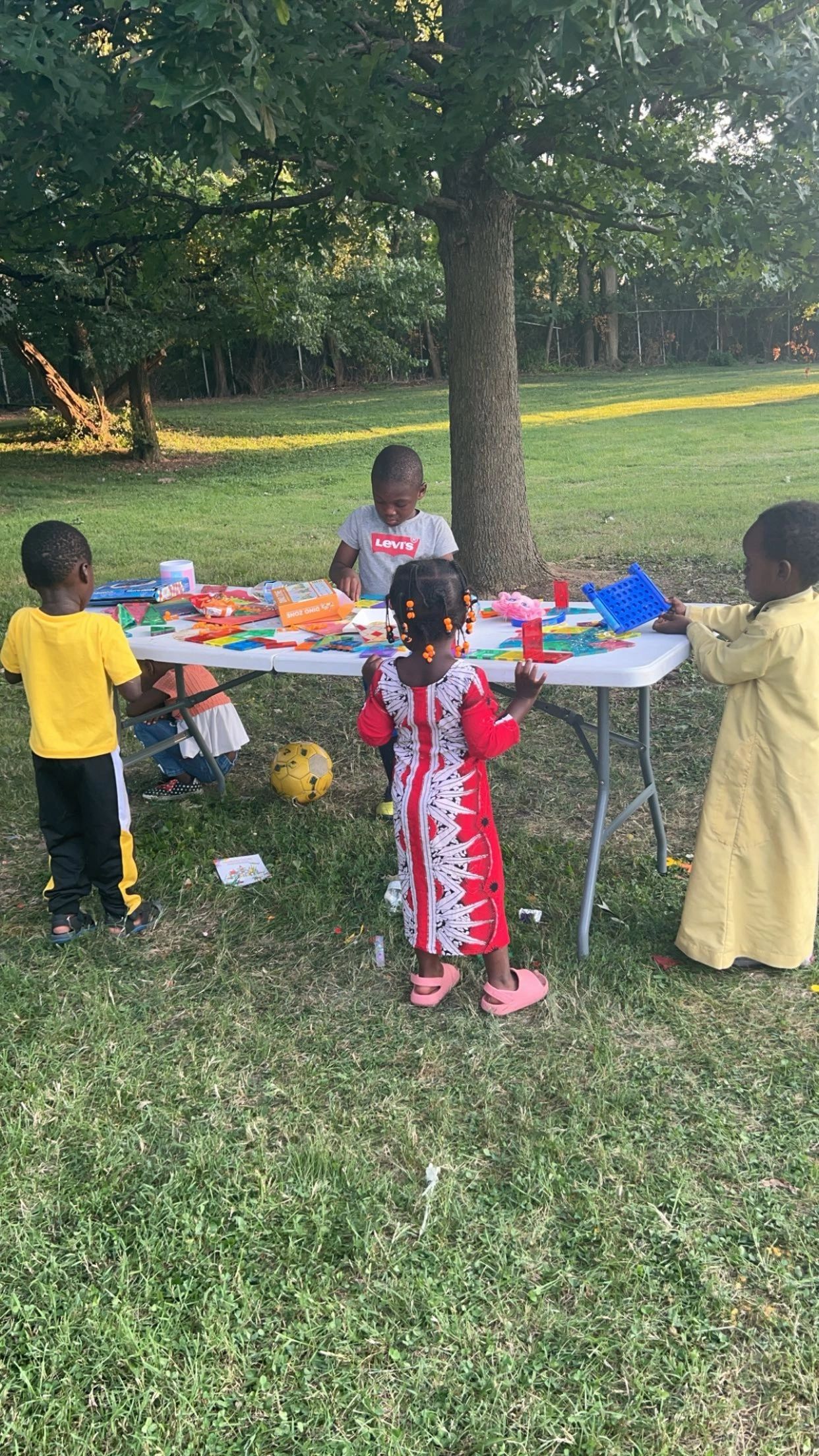 Kids doing arts and crafts outdoors