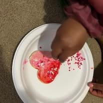 Kids learning to cook traditional cultural foods together in a community kitchen