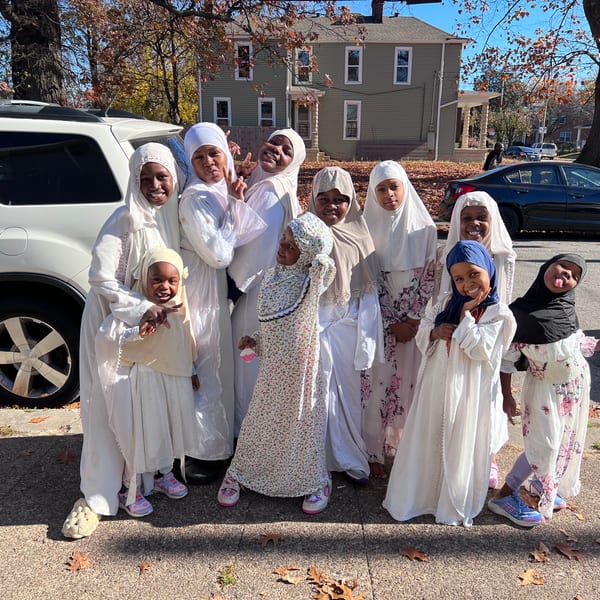 Diverse women laughing and celebrating together at a community gathering