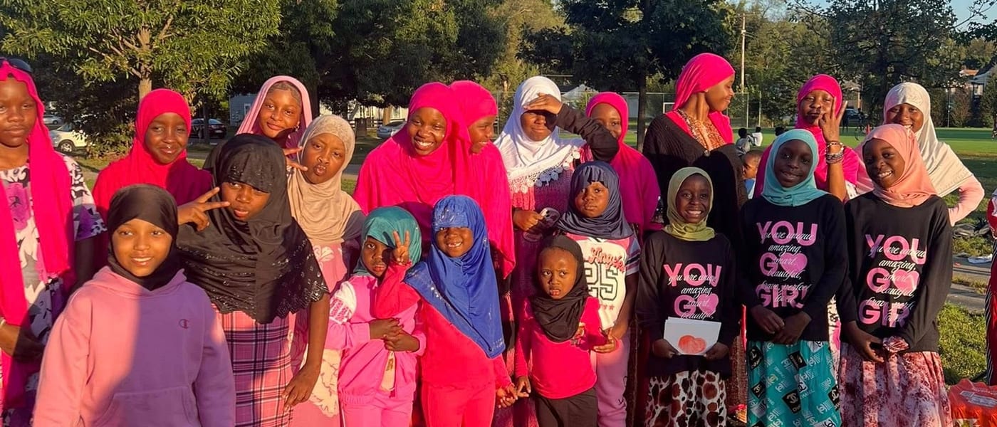 Group of girls posing outdoors in colorful hijabs