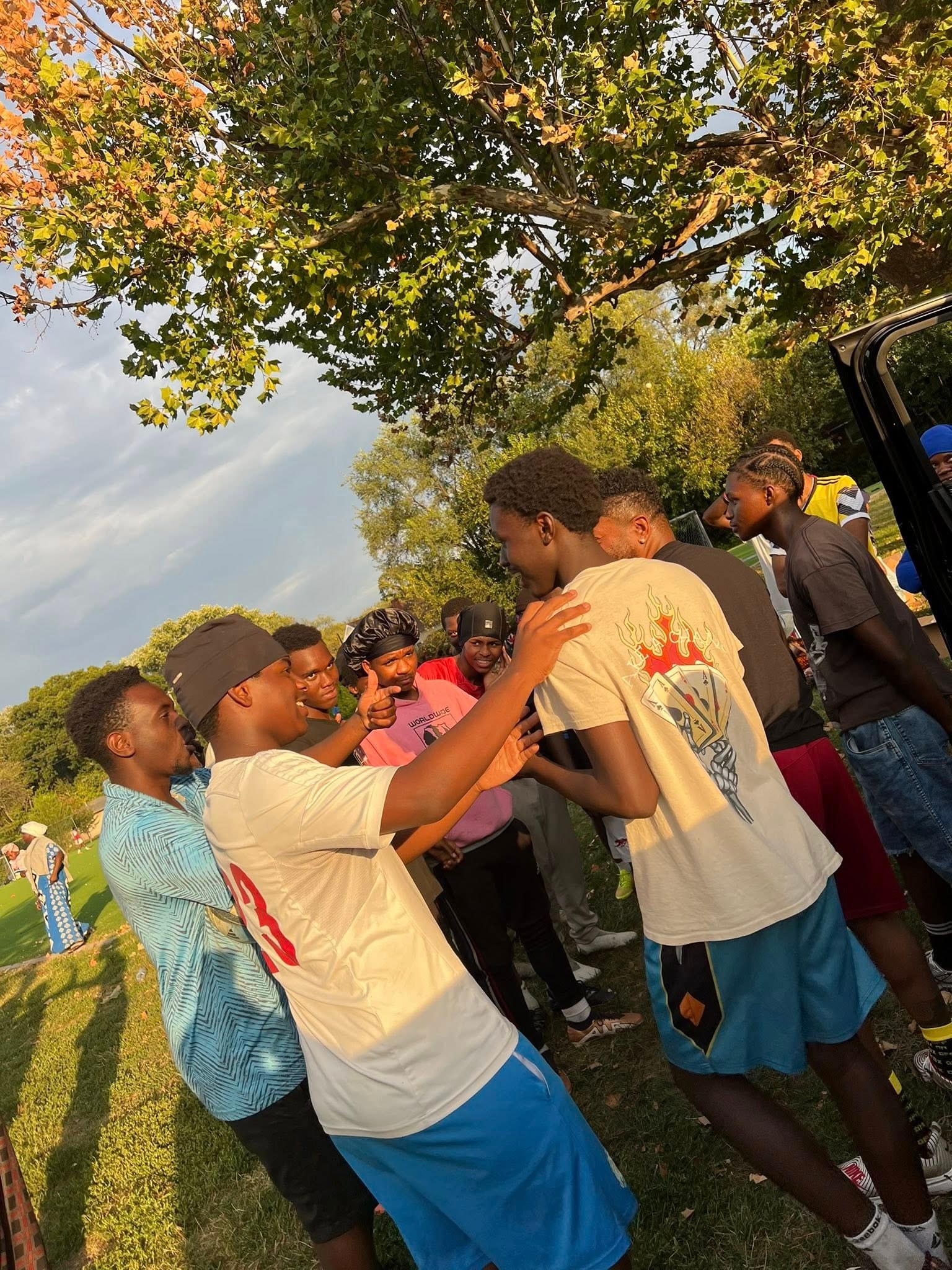 Young people dancing together outdoors