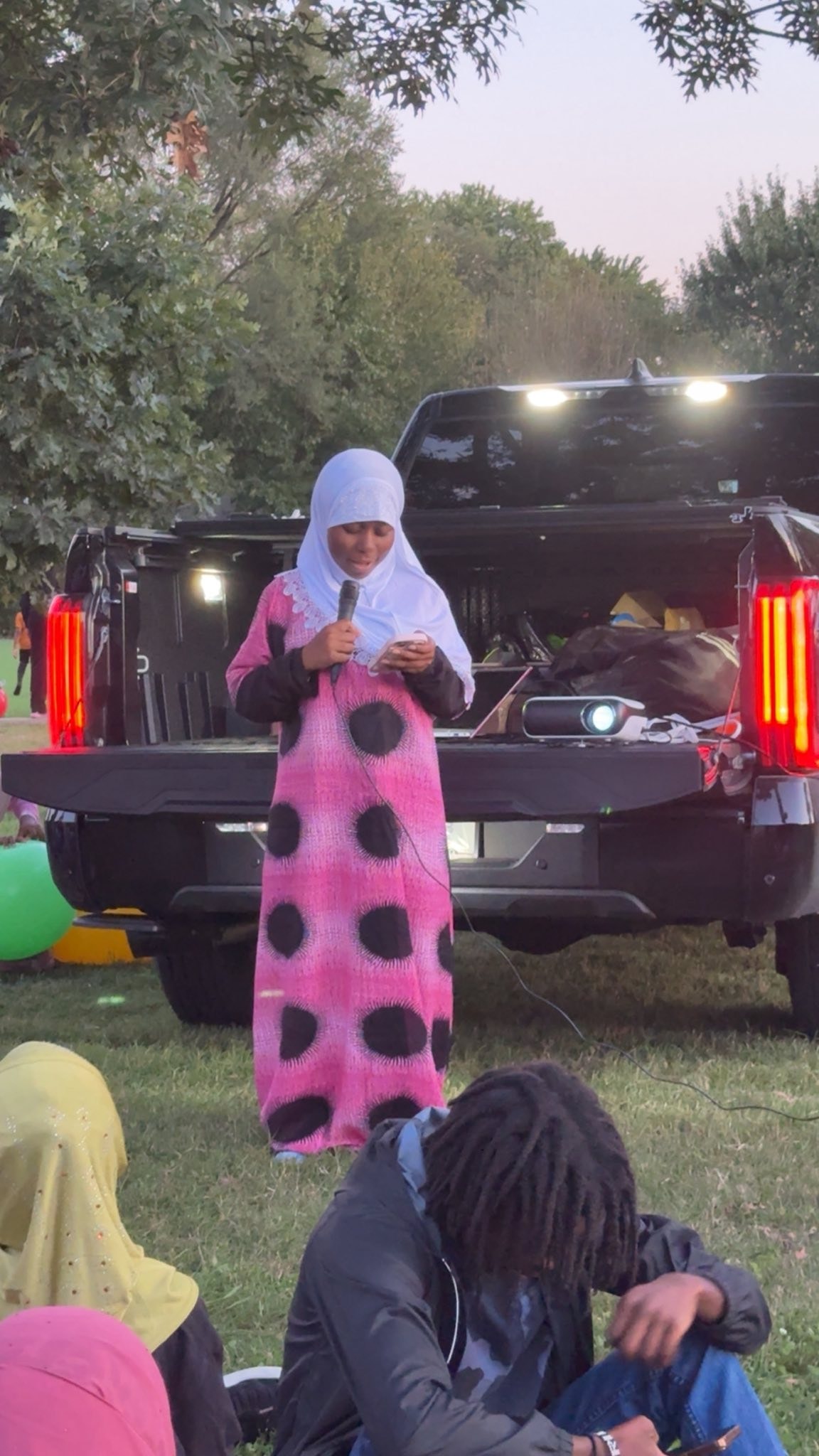 Child performing at an outdoor event
