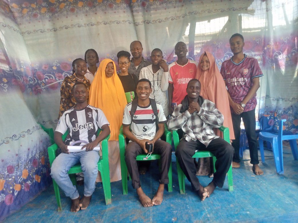 Group of young people posing together indoors