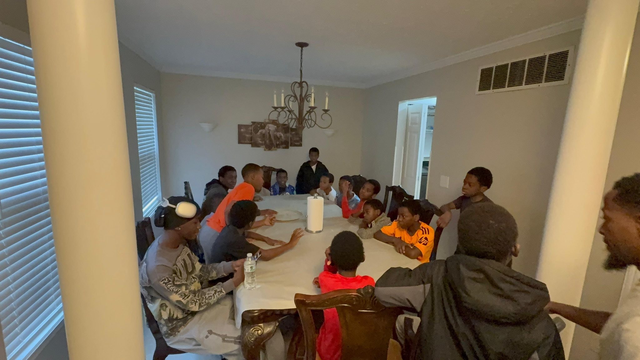 Large group gathered around a dining table