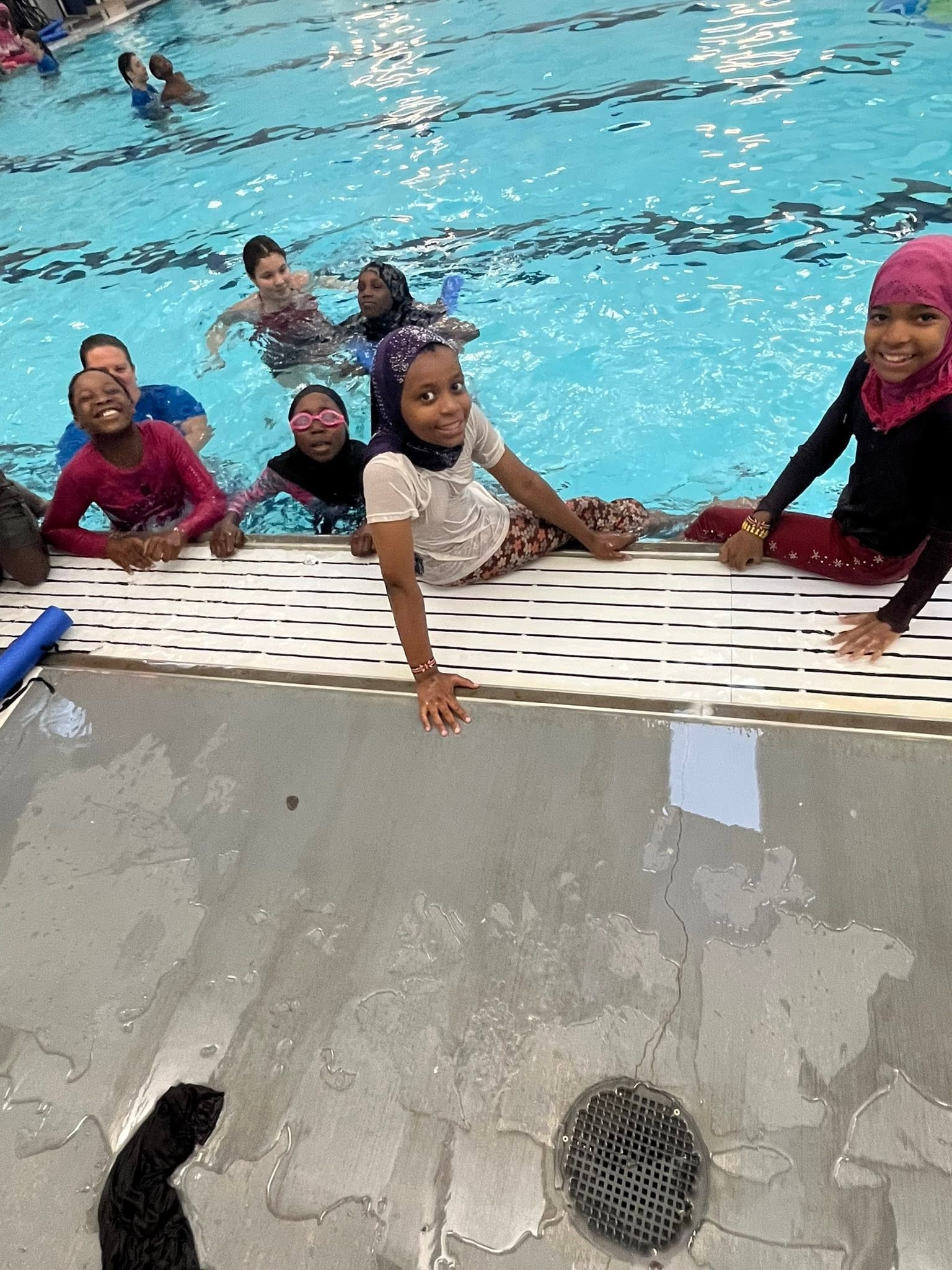 Children at an indoor swimming pool class