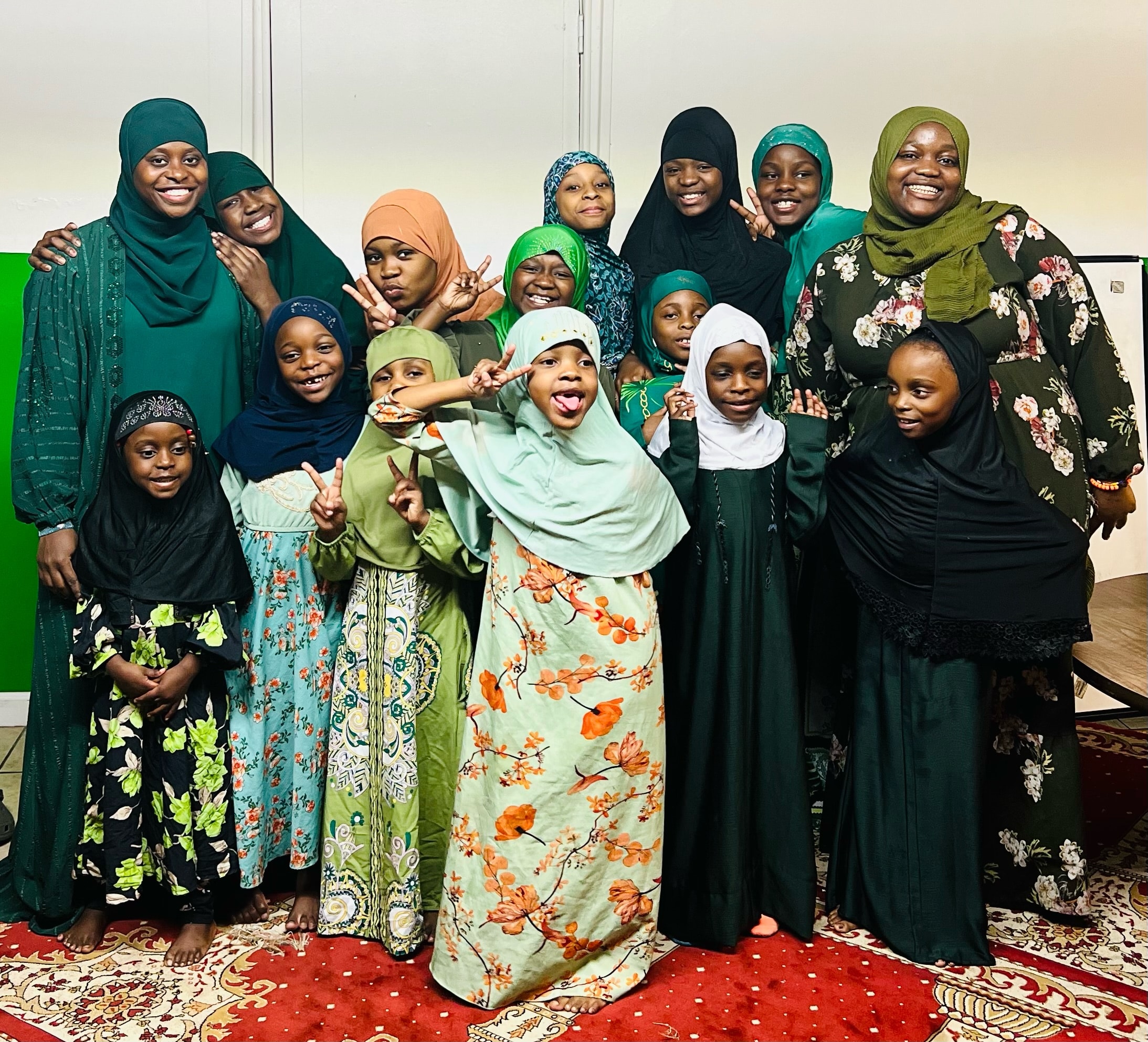 Diverse group of women and girls smiling together